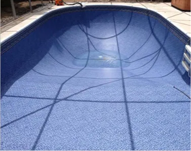 Completed vinyl liner replacement in an inground pool, showcasing a smooth, blue finish by Kristi's Pool Service.